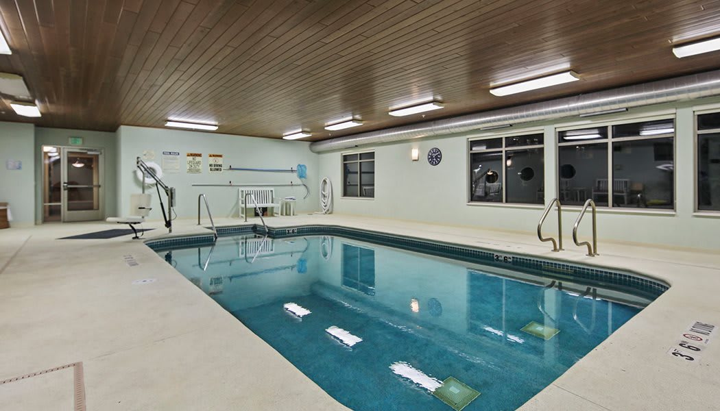 An indoor swimming pool with a calm atmosphere and inviting waters.