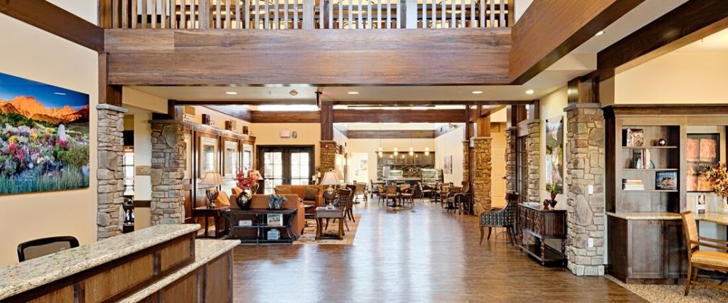 A spacious and welcoming lobby area with comfortable seating and wooden accents.