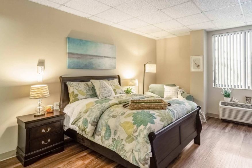 A cozy bedroom with elegant decor and a comfortable bed.