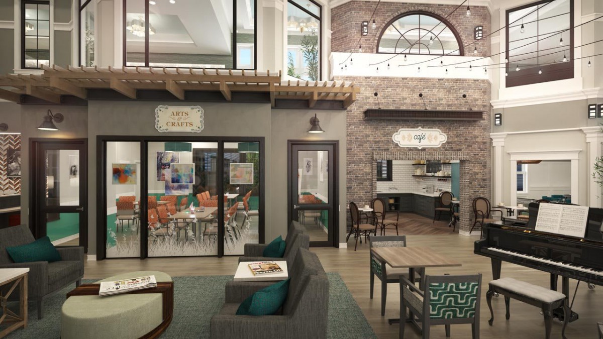 A modern lounge area with brick walls, comfortable seating, and a caf.