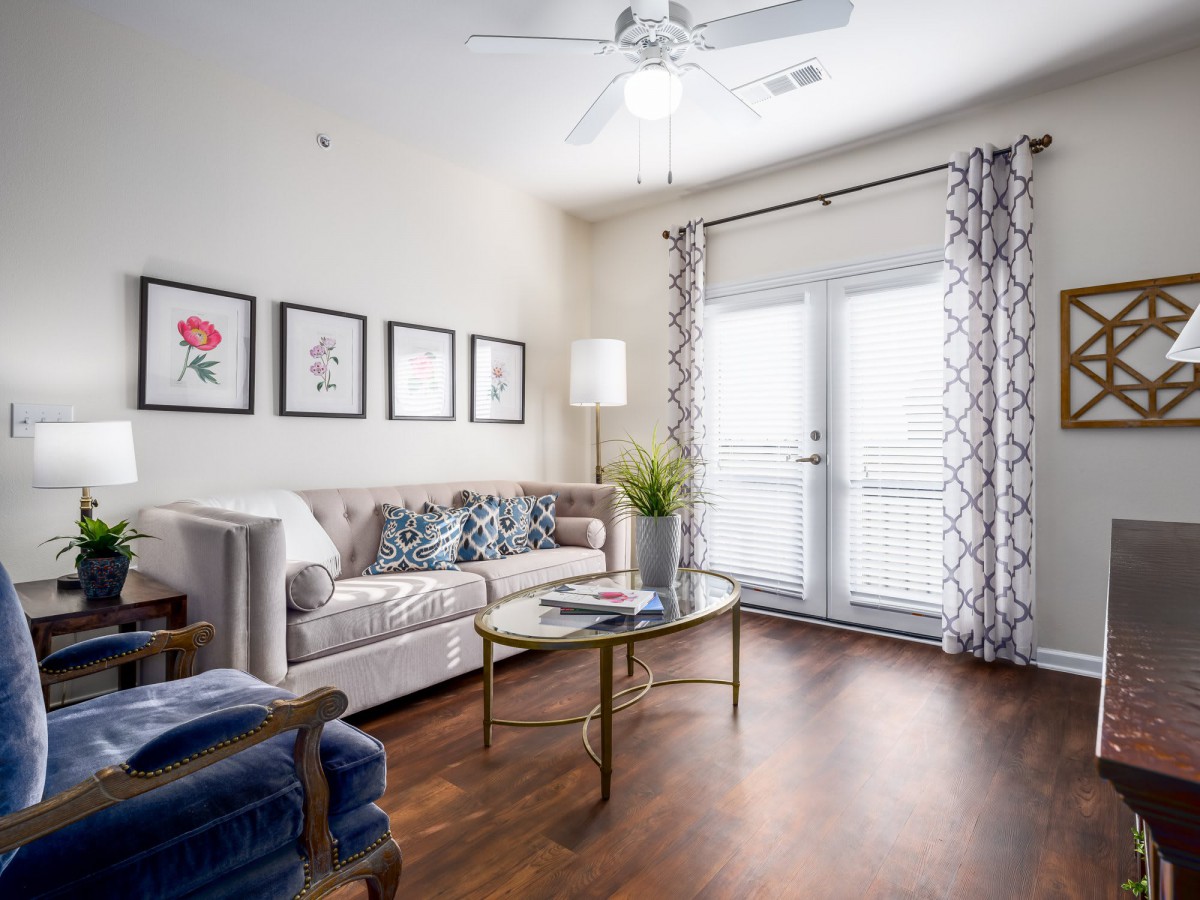 A modern living room with a cozy sofa, elegant coffee table, and stylish decor.