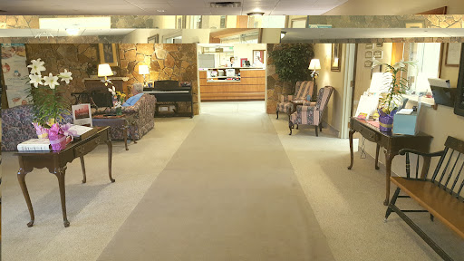 A warm and inviting hotel lobby with comfortable seating and ambient lighting.