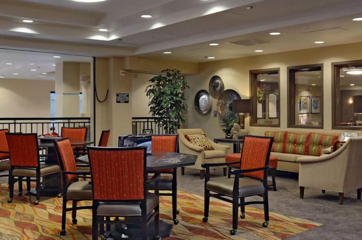 A cozy hotel lobby with comfortable seating and warm decor.