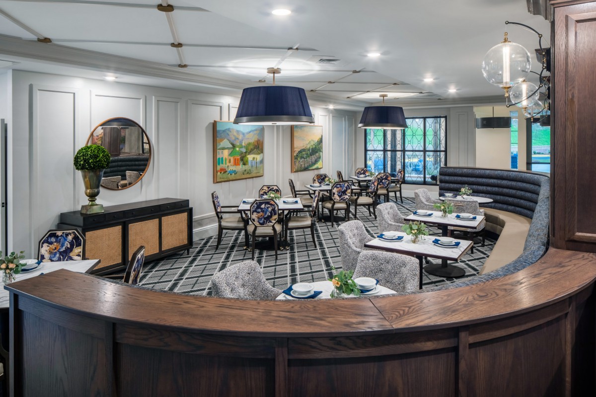 A modern restaurant dining area with elegant decor and stylish lighting.