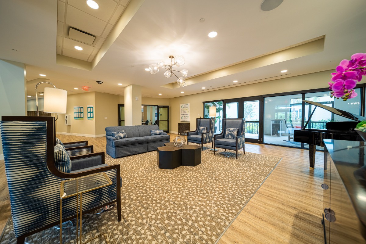 A modern lounge area with comfortable seating and elegant lighting.