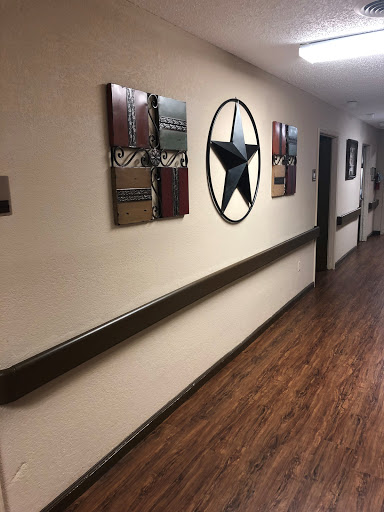 A cozy hallway adorned with stylish wall art and a wooden floor.