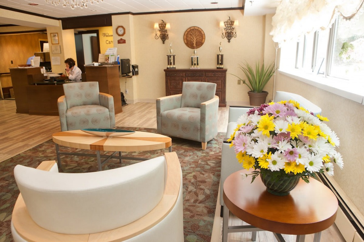 A cozy and elegantly decorated lobby with comfortable seating and floral arrangements.