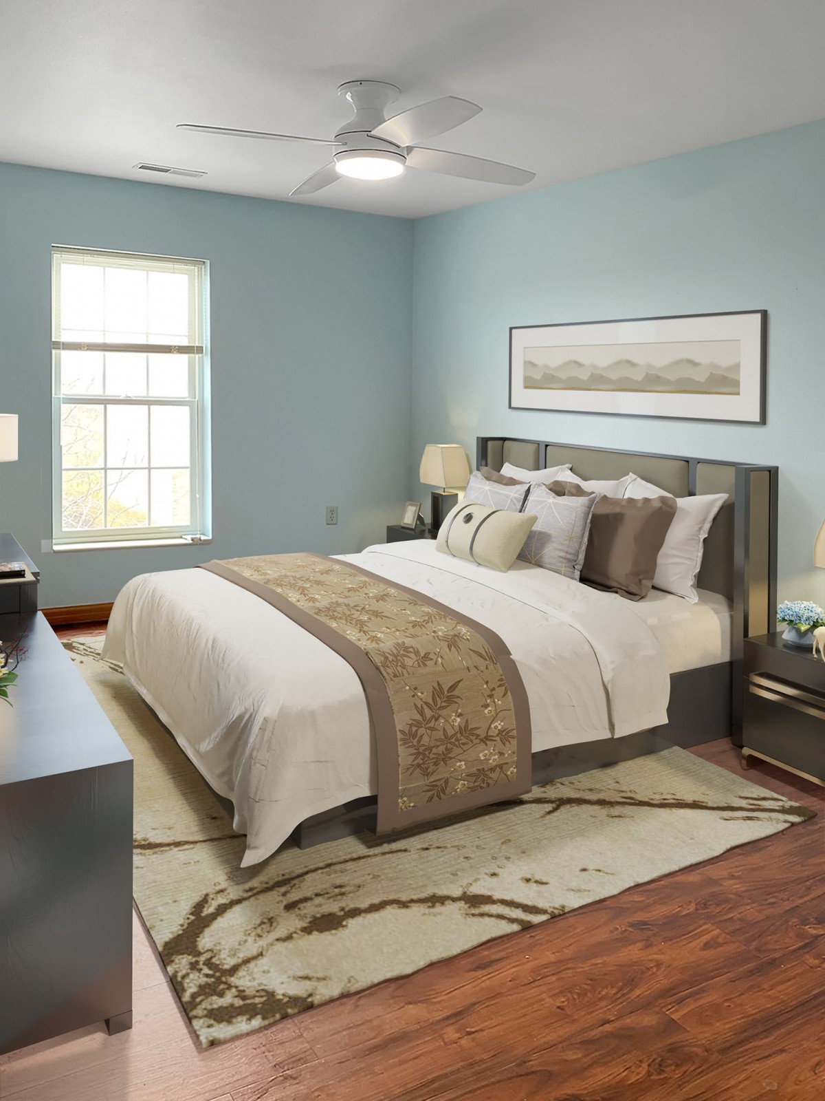 A modern and comfortable bedroom with stylish decor and a large window.