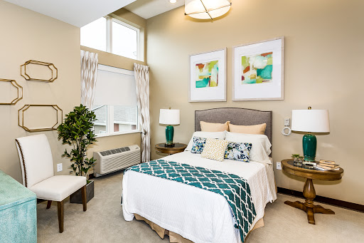 A beautifully designed modern bedroom featuring calming colors and stylish decor.