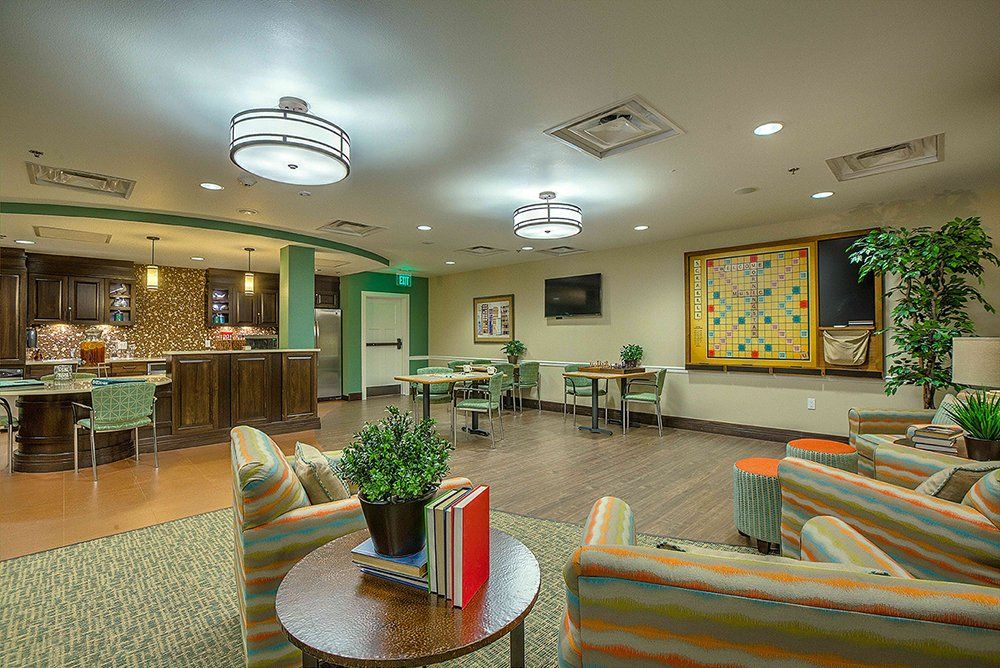 A modern lounge area with comfortable seating, contemporary lighting, and decorative elements.