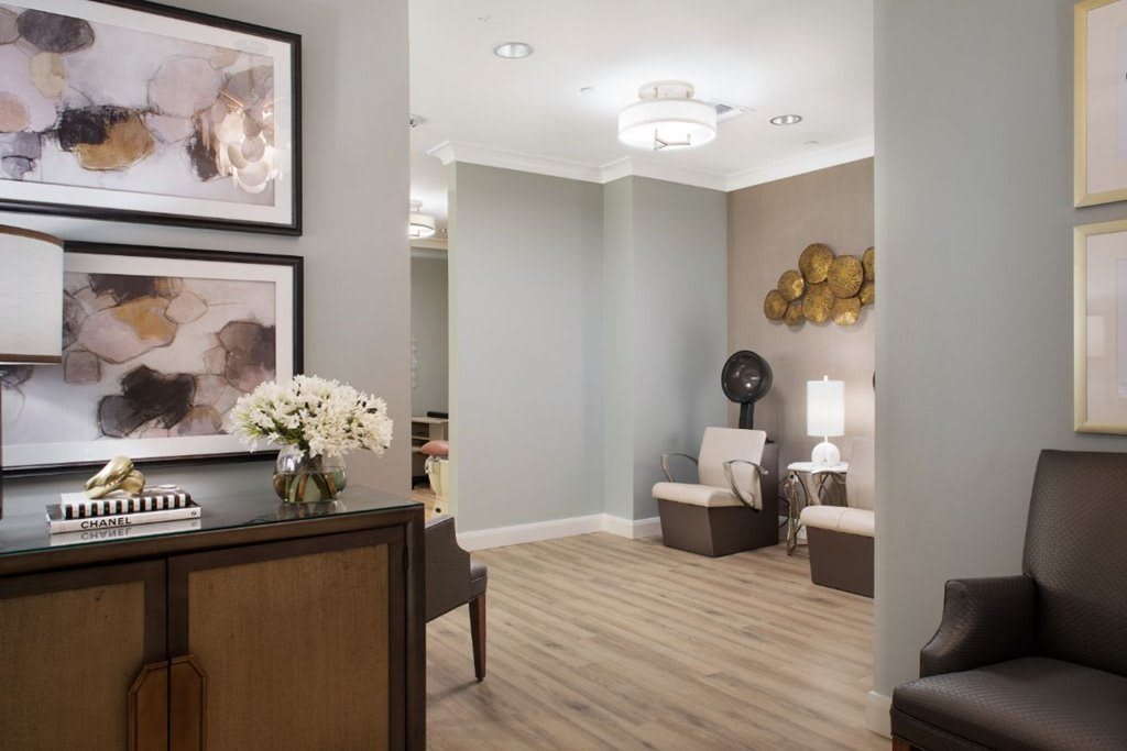 A modern waiting room with stylish decor and comfortable seating.