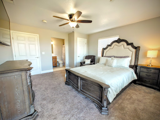 A beautifully designed bedroom featuring elegant furniture and a cozy ambiance.