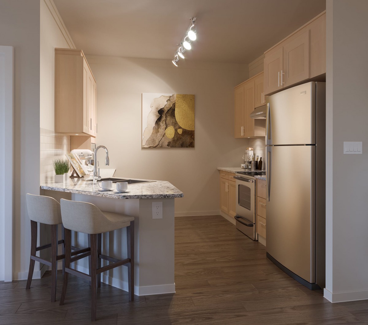 A modern kitchen with stainless steel appliances and a breakfast bar.