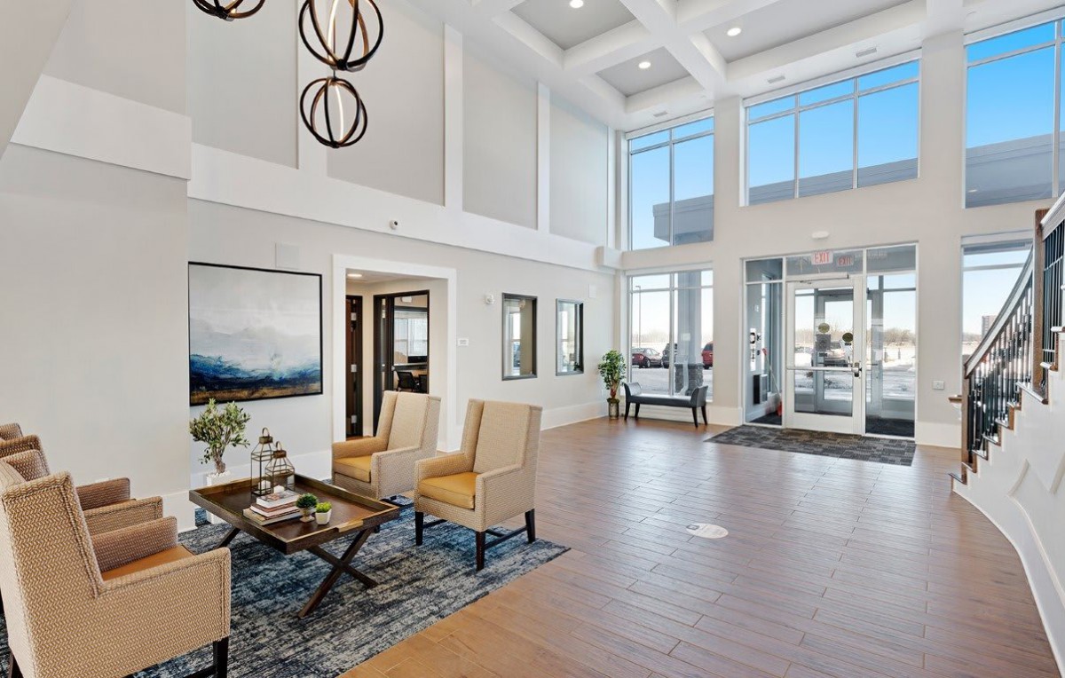 A modern and spacious lobby with stylish furnishings and contemporary lighting.