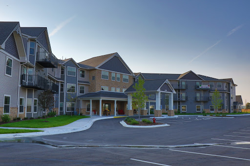 A modern residential building showcasing elegant architecture and a well-maintained entrance.