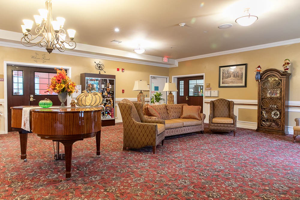 A cozy lobby area featuring elegant furniture and warm lighting.