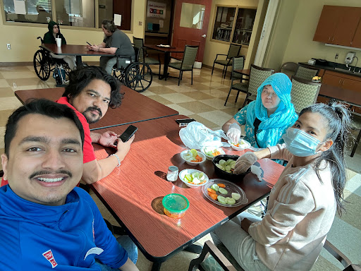 A fun gathering with friends enjoying a meal together.