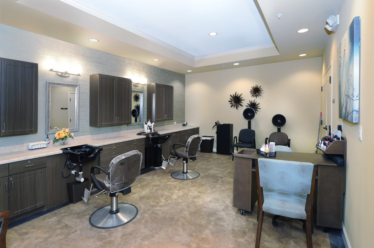 A modern hair salon with styling chairs and mirrors.