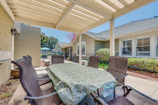 A cozy outdoor patio set up for dining and relaxation.