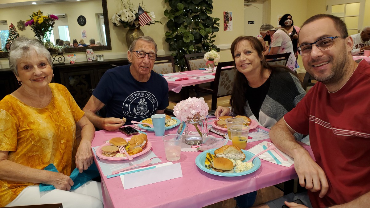 A group of people enjoying a meal together at a restaurant.