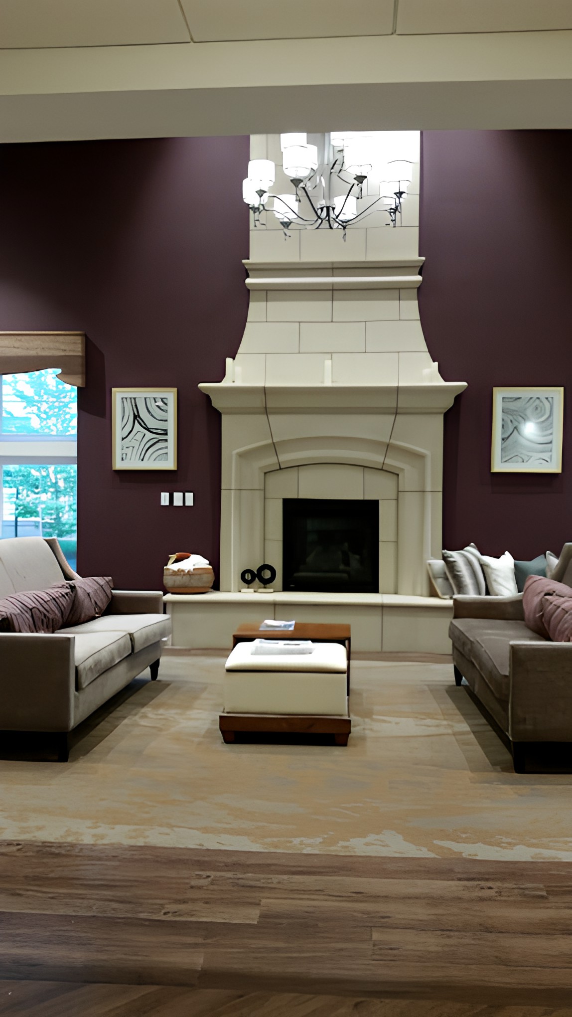 A modern living room with a central fireplace and comfortable seating area.