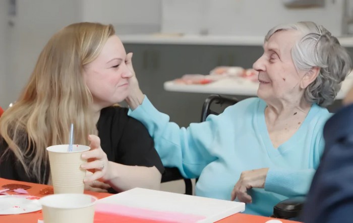 A warm interaction between two individuals, showcasing affection and connection.