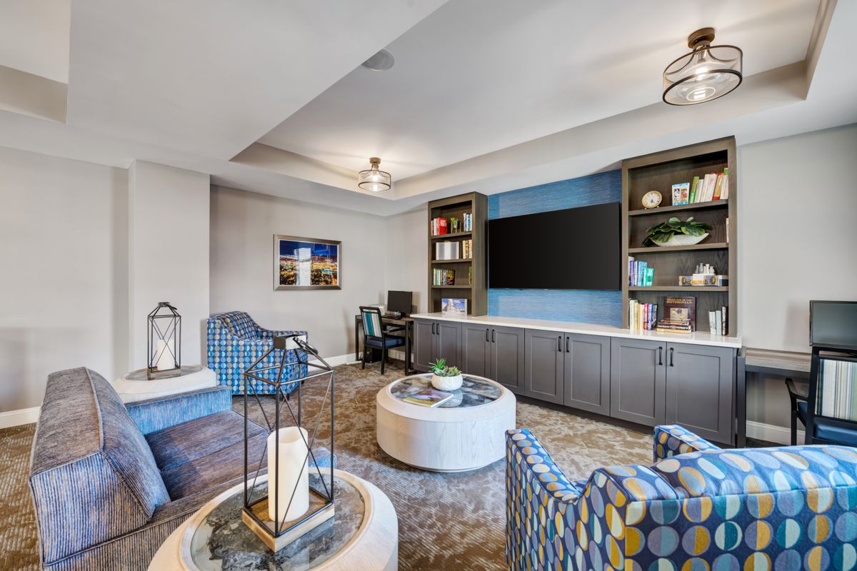 A modern living room with comfortable seating and stylish decor.