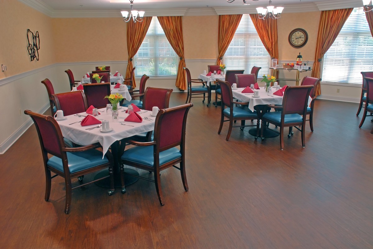 A neatly arranged dining room with tables set for service.