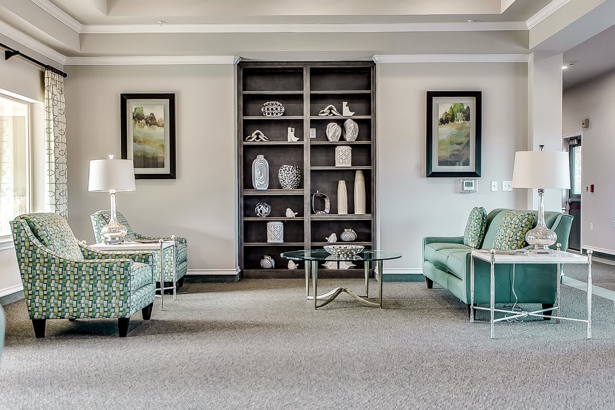 A cozy living room with a stylish arrangement of furniture and decorative items.