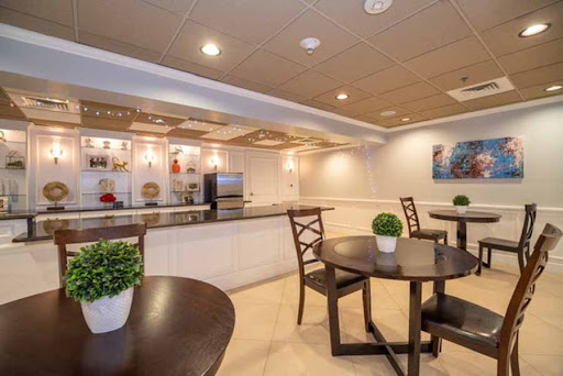 A modern cafe space featuring tables and chairs, perfect for a cozy breakfast or casual meeting.