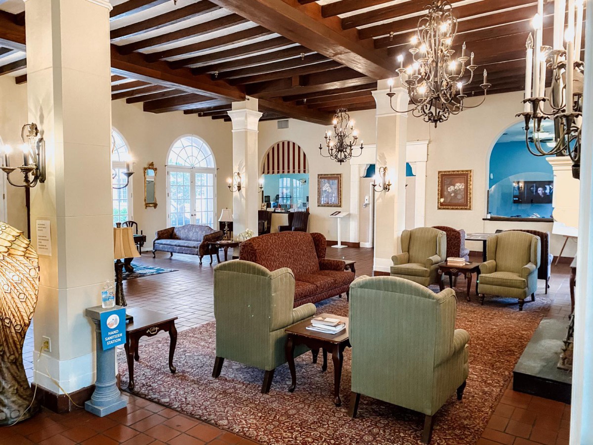Elegant lobby with classic furniture and chandeliers.