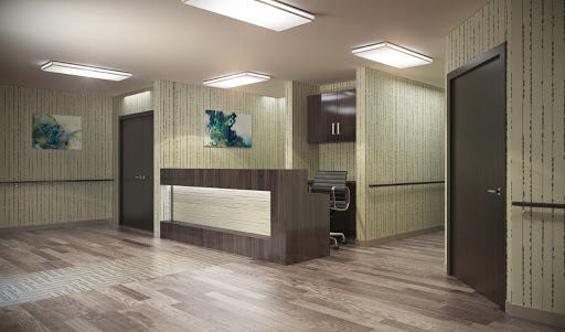 A modern reception area featuring sleek furniture and warm lighting.