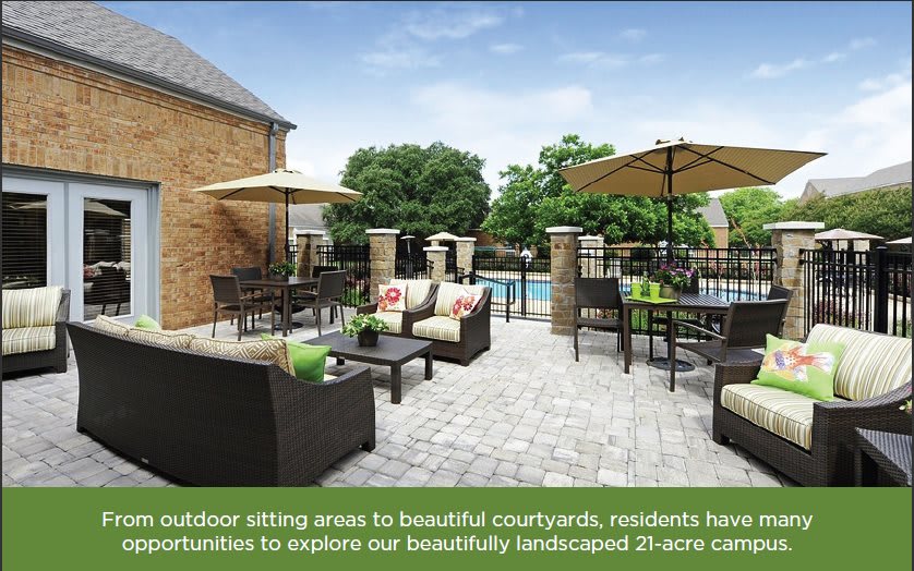 A landscaped courtyard with comfortable outdoor seating and a pool, perfect for relaxation.