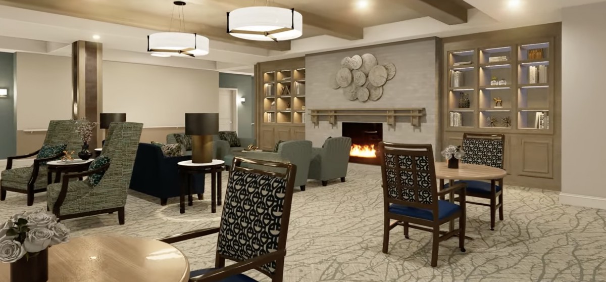 A modern lounge area featuring a fireplace, comfortable seating, and stylish decor.