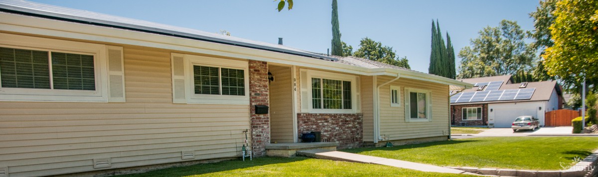 A suburban single-story house with brick and siding exterior.