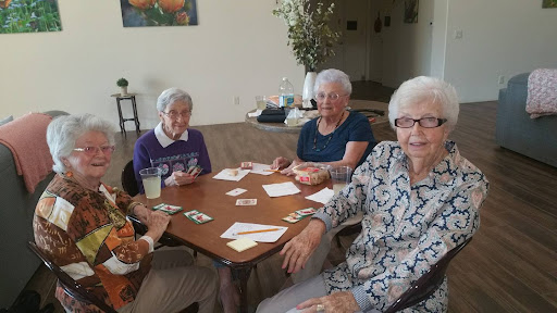 A group of seniors enjoying a card game together.