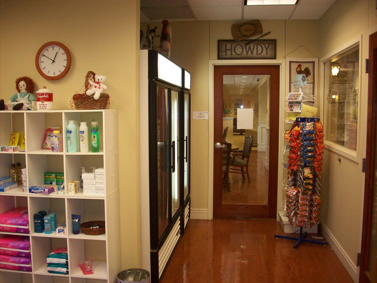A veterinary clinic interior with pet supplies and a waiting area.