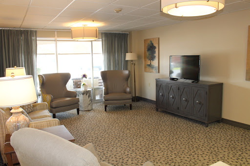 A cozy living room with elegant furnishings and ample natural light.