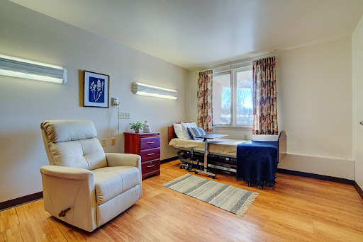 A well-furnished hospital room designed for patient comfort and care.