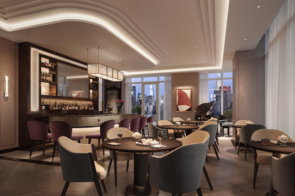 A modern restaurant interior featuring a well-lit dining area with stylish furniture and a bar.