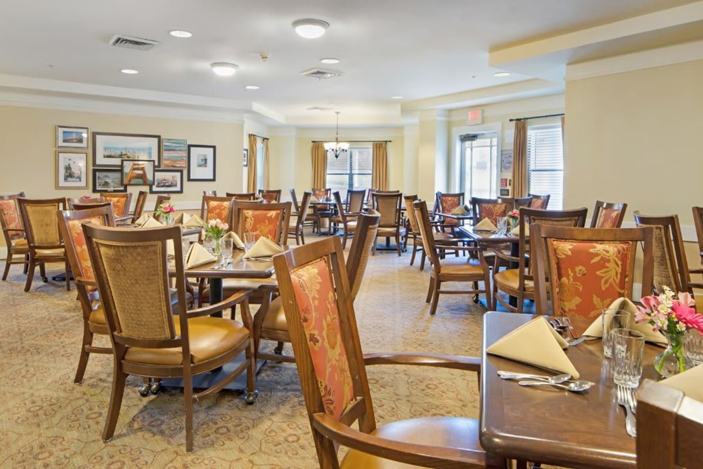 A well-decorated dining area with neatly arranged tables and chairs.