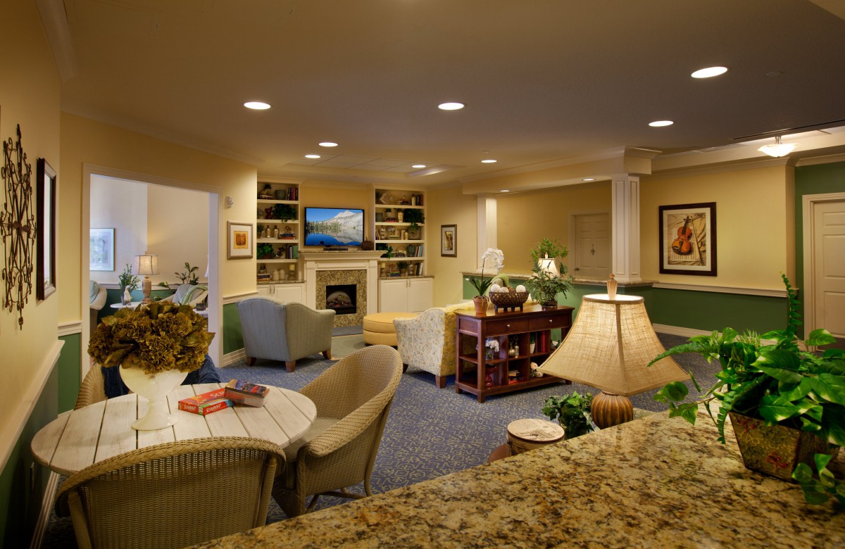 A cozy living room with a fireplace, television, and comfortable seating area.