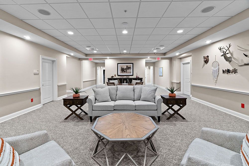 A well-lit lobby with comfortable seating and stylish furniture.