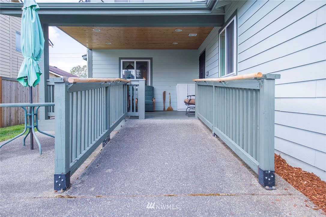 An accessible ramp leading to the entrance of a building.