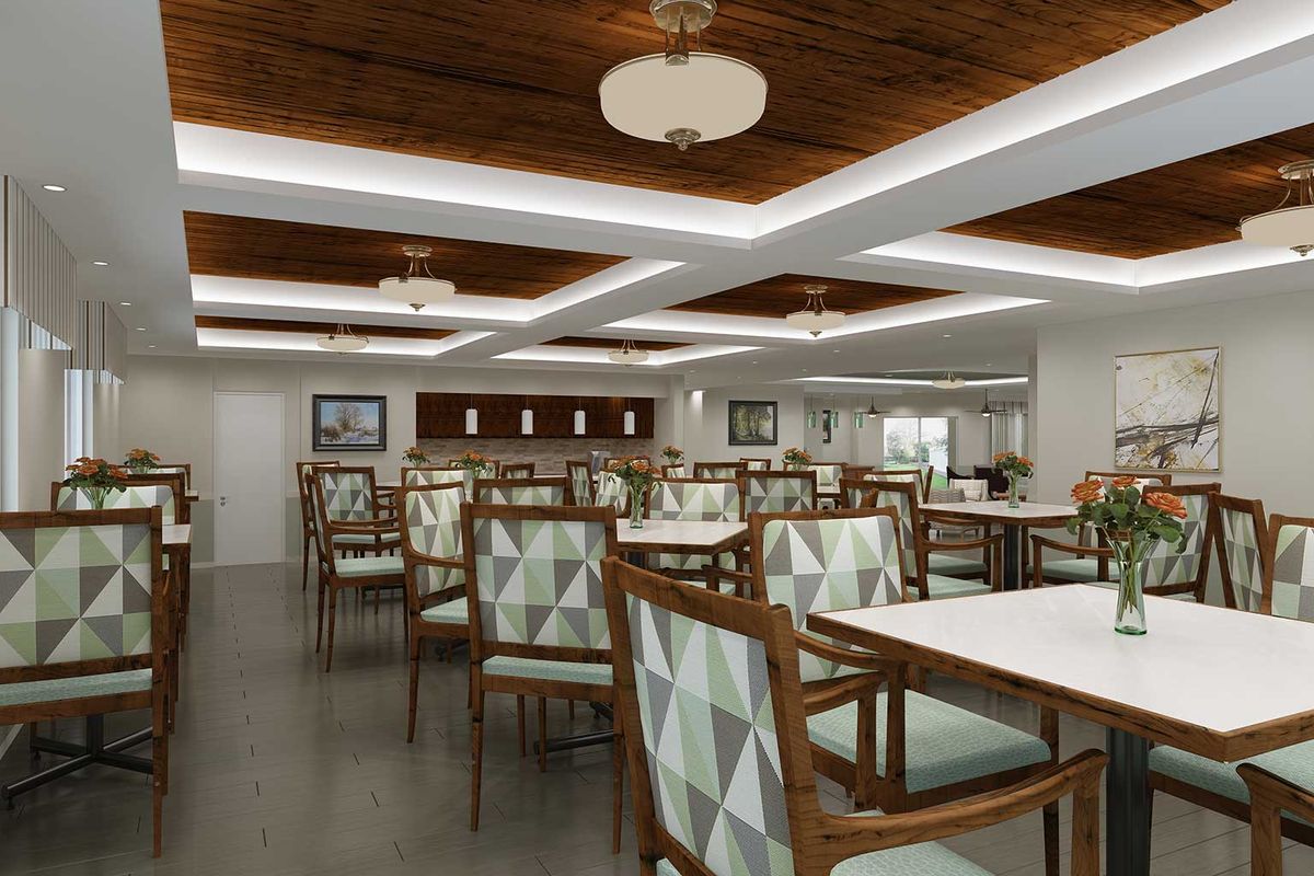 A modern restaurant interior with neatly arranged tables and chairs, featuring geometric patterns.
