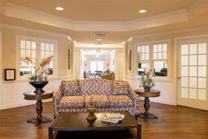 A cozy living room with elegant furnishings and warm lighting.