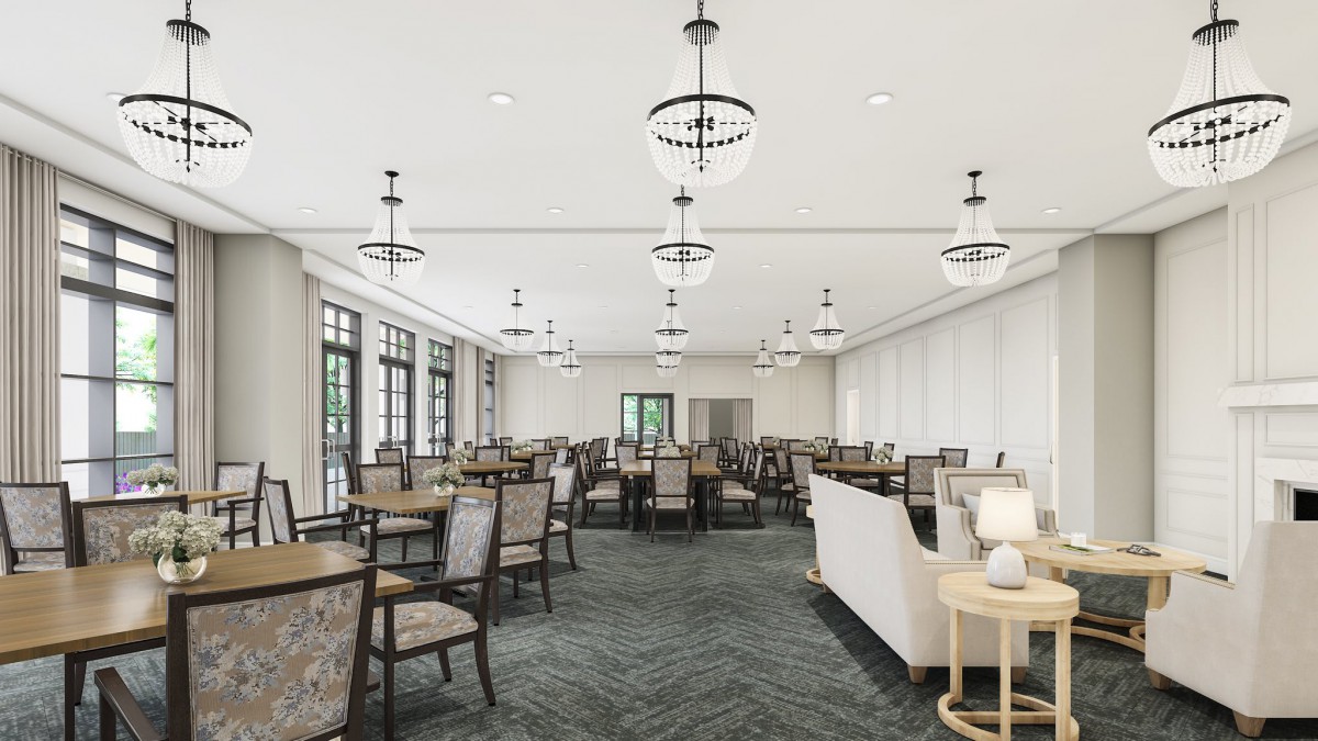 A spacious dining room with multiple tables and chairs, featuring elegant lighting fixtures and large windows.