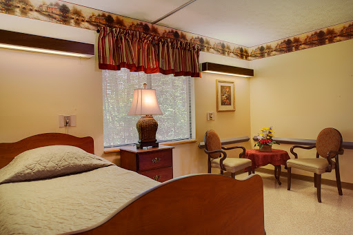 A cozy bedroom featuring warm decor and comfortable furnishings.