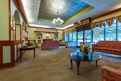 A cozy lobby area featuring elegant furnishings and natural light.