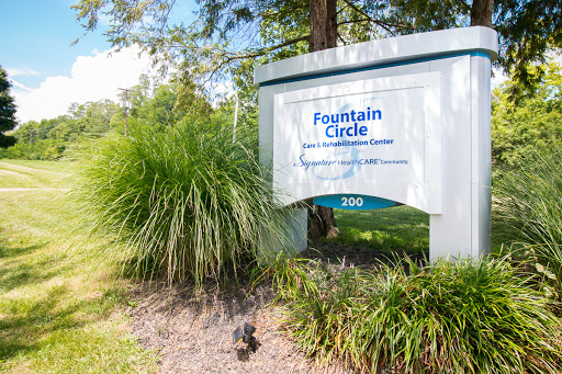 Welcome to Fountain Circle, a community space surrounded by lush greenery.